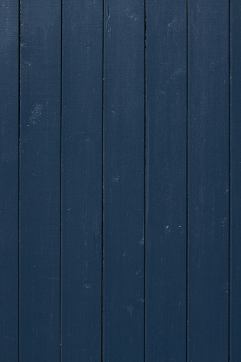 Wooden fence painted in a blue color.
