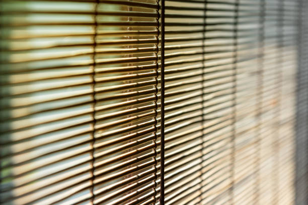 istock Straw window blinds close-up with differential focus. 1401507400
