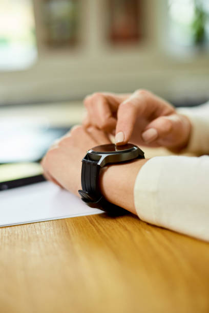istock Unrecognizable woman using smartwatch, Freelancer female with smart watch 1401515951