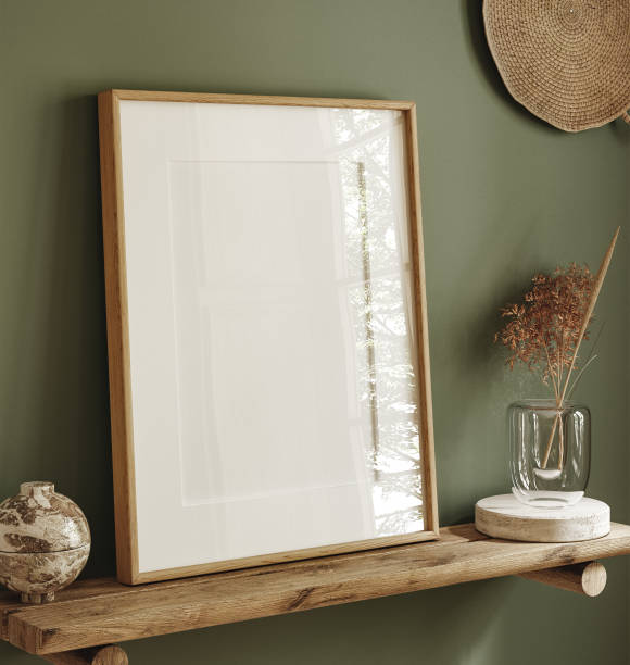 istock Mock up poster frame on shelf close up in dark green interior background 1401517072