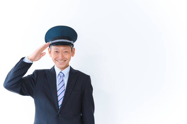 Conductor working with a smile Conductor working with a smile transport conductor stock pictures, royalty-free photos & images