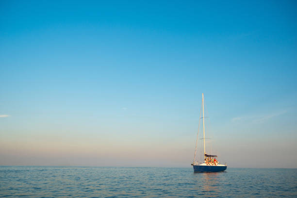 Sea voyage on a sailing yacht. Calm on the sea. Walk on a yacht on the ocean. Cruise on a yacht. Young people is resting on the sailing yacht. Sailing yacht at sea. Yachting.
