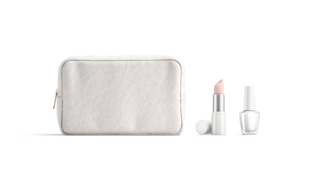 Blank white cosmetic bag, lipstick tube and nail polish mockup Blank white cosmetic bag, lipstick tube and nail polish mockup, 3d rendering. Empty female beauty case with pomade and nailpolish mock up, isolated. Clear visagiste cosmetics stuff template. make up bag stock pictures, royalty-free photos & images