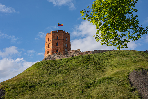 Vilnius, Lithuania - June 3, 2022: Gediminas Tower on the hill in the old town center in Vilnius, Lithuania. The tower is an important state and historic symbol of the city of Vilnius.