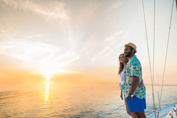 istock Young couple standing on yacht. 1401519700