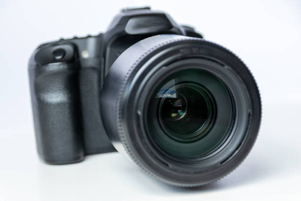 istock Professional dslr camera equipment with 70-300 mm tele zoom objective with wide camera lens in macro close-up view shows details of photographic equipment for studio shots and portrait wildlife photos 1401521052