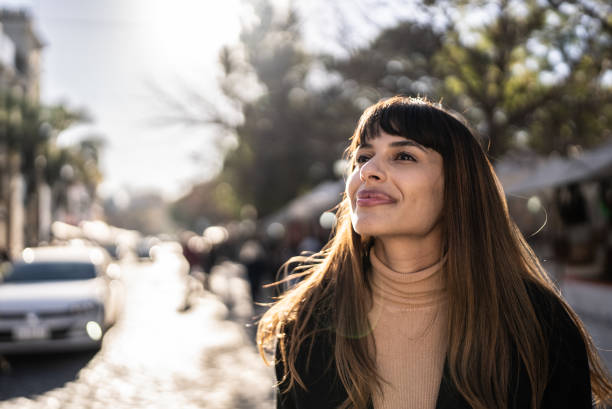 istock Happy young woman exploring city 1401521421