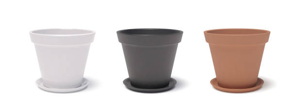istock 3D realistic glossy white, black and terracotta ceramic flower pots with trays and dropping shadows. Three-dimensional empty reservoirs for house plants. Vector isolated clipart 1401521481