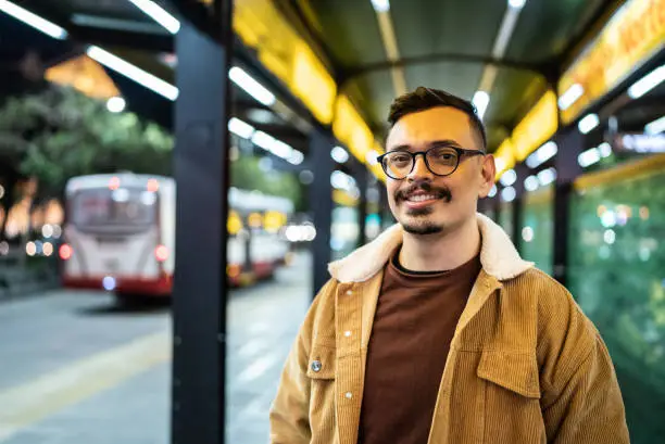 Photo of Portrait of a happy young man outdoors