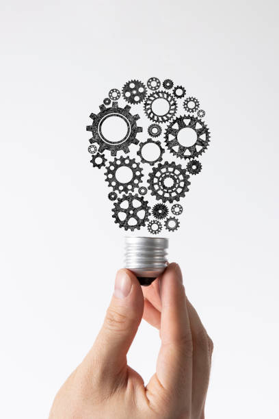 istock Hand Holding Light Bulb Made of Gears 1401522463