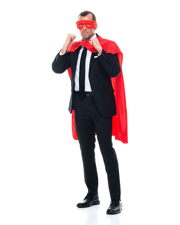 One person of aged 40-44 years old with short hair caucasian young male heroines standing in front of white background wearing mask - disguise who is conquering adversity