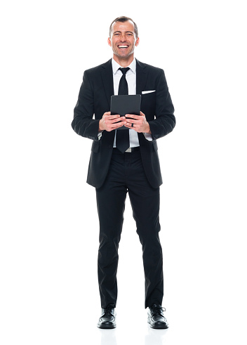 Front view of aged 40-44 years old with short hair caucasian young male standing in front of white background wearing businesswear who is learning and touching and using touch screen