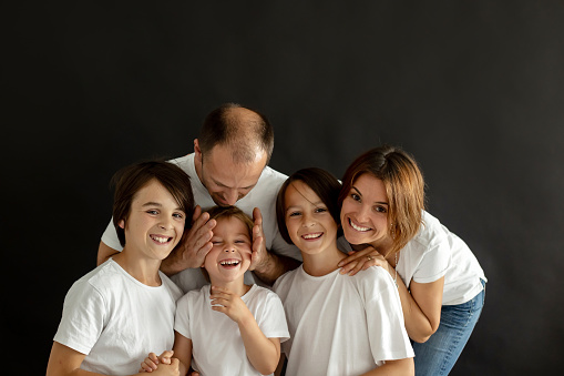Isolated portrait of a children and parents,, family, happy people on black background