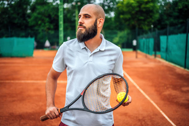 istock Man with a tennis racket 1401527783