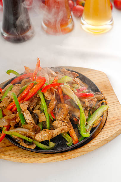 istock original fajita sizzling hot  on iron plate 140152882