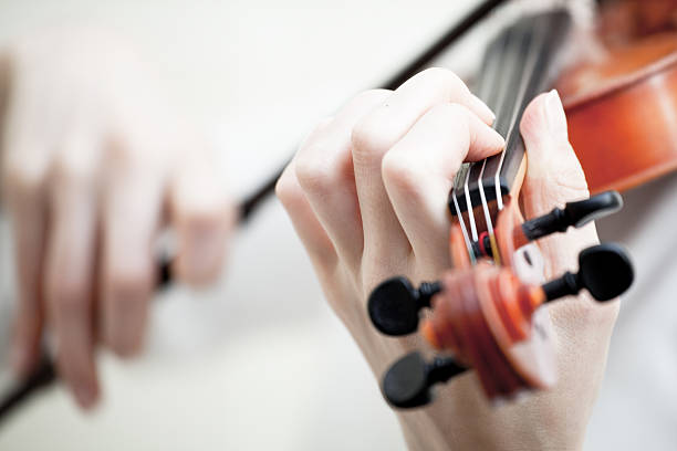 istock Musician playing violin isolated on white 140152918
