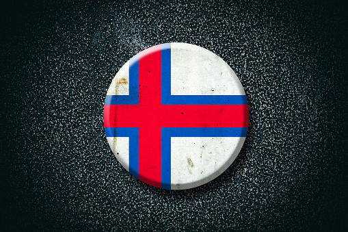 Faroe Islands. Round badge, on a dark background. Signs and Symbols. Flags.3D illustration.