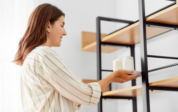 istock woman decorating home with candles 1401529905