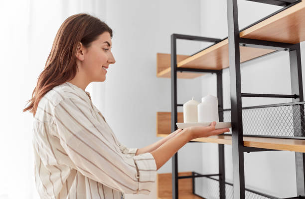 istock woman decorating home with candles 1401530017