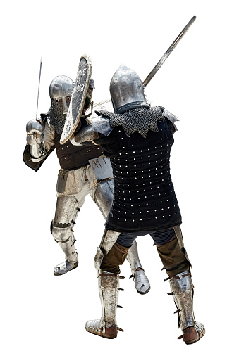 Soldiers from medieval times walks next to each other. They wear armor and helmets. One of them rides a horse.