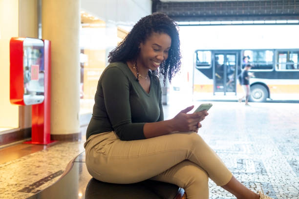 istock Woman using smart phone in the city. 1401531597