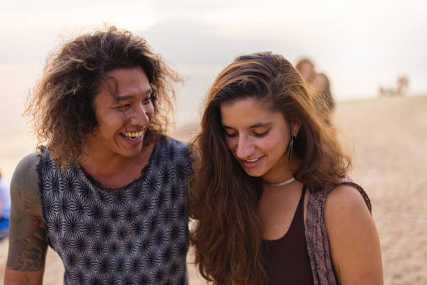 istock Multiracial couple on the beach having fun 1401532733