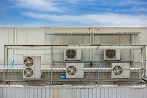 istock Air conditioner compressor installed in old building. Outdoor split wall type air conditioner compressor unit inverter installed on the outside of the building. Air conditioner compressor outdoor unit 1401533041