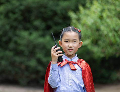 Supergirl Using Walkie-Talkie