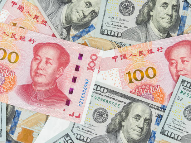 istock U.S Dollar and Chinese Yuan Note Background 1401534796