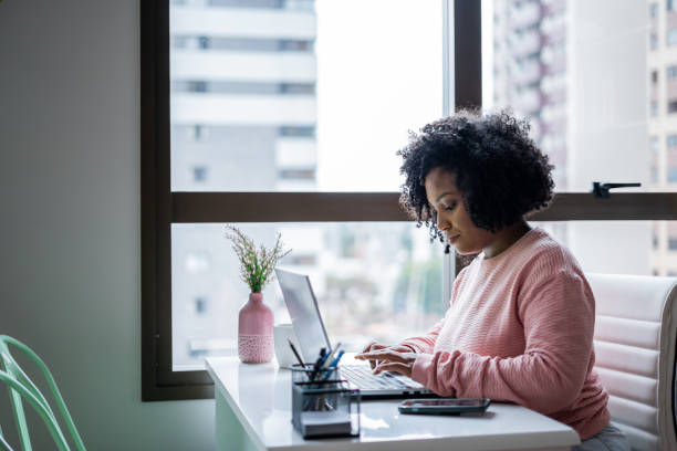 istock Black woman working from home 1401536650