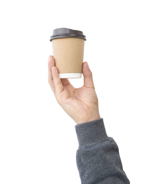 A paper cup of coffee in the hand isolate on white background clipping path
