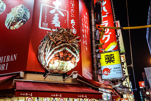 Osaka, Japan - January 11, 2020: Giant Seafood Figure of the Restaurant  on the Illuminated Japanese Dotonbori Street in Night Osaka