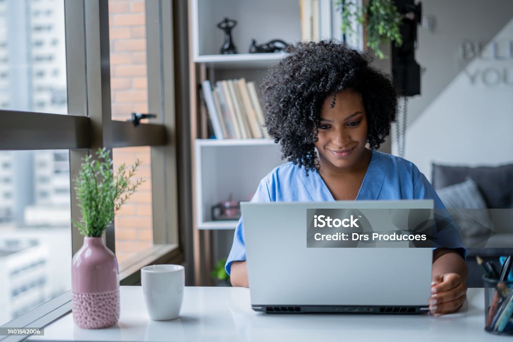 Nurse in consultation by video call Using Computer Stock Photo