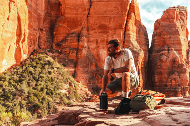istock Adventurous man enjoying nature and looking at the view 1401544936