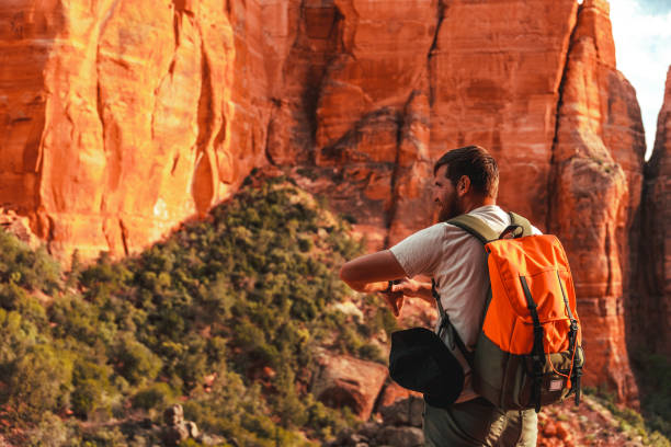 istock Young man enjoying nature and exploring 1401544994