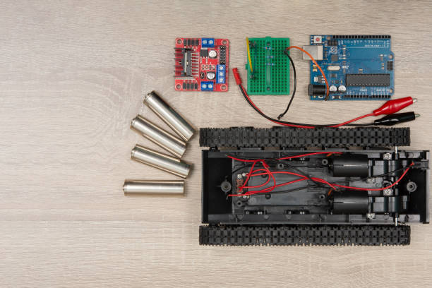 istock DIY robot competition ideas. STEM education for kids. A robot and an electronic board that can be programmed. 1401545020