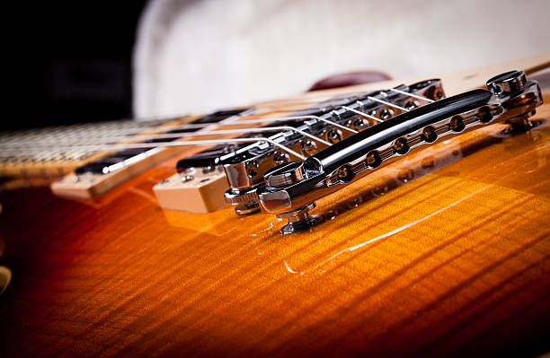 istock Close Up of Sunburst Electric Guitar Bridge 140154711
