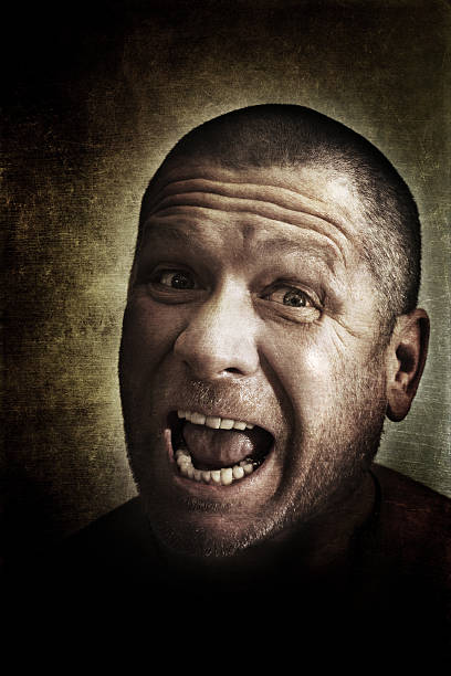 istock dark picture of a screaming man 140154890