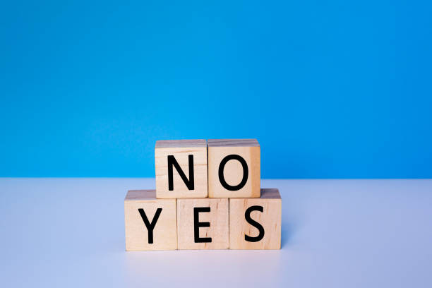 istock Yes and No on wooden cube. Decision, choosing and answer concept. 1401549069