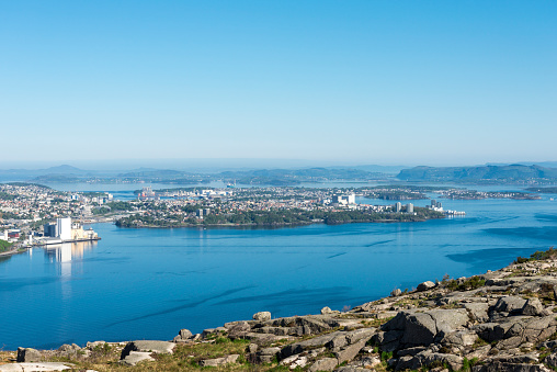 A spectacular view to Gandsfjord and Stavanger suburbs while hiking to Lifjel mountain near Sandnes, Norway, May 2018