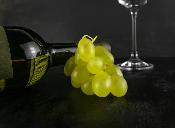 istock White grapes and a bottle of wine 1401557041