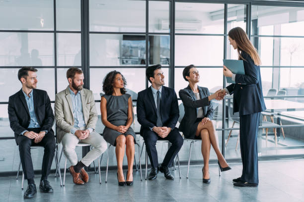 istock HR manager handshaking with candidate at job interview. 1401557244
