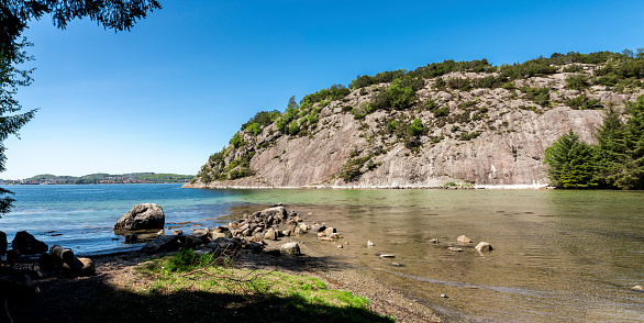 A small bay with turquoise water in Gandsfjord fjord near Dale, Sandnes, Norway, May 2018