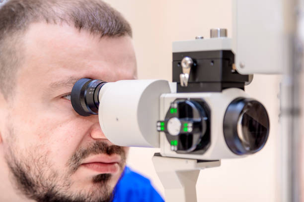 istock A male ophthalmologist checks a patient's vision with a modern device with a light beam 1401562853