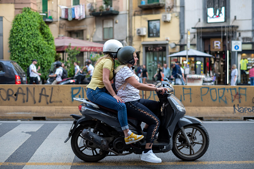 Naples, Italy - May 25, 2022: The citizens of Naples love to move around the city using the moped as a preferential means of transport.