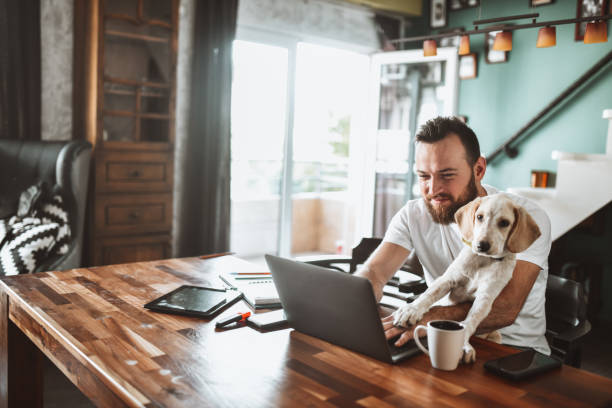 istock Puppy Making His Owner Happy While Working From Home 1401567079