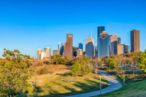 The modern skyline of Houston Texas shot from the urban Elenor Tinsley Park located adjacent to downtown.