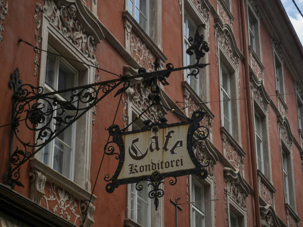 istock Graz Austria historical house building cafe sign 1401568436