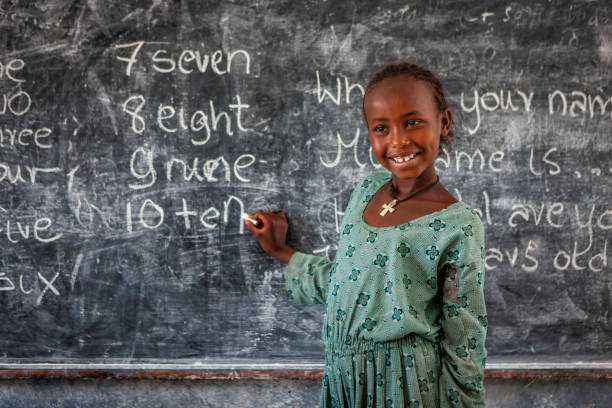 istock African little girl is learning English language 1401568878