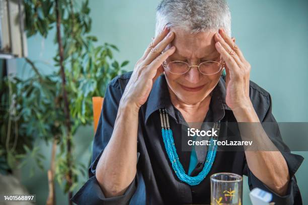 Old Woman Experiencing Strong Headache Stock Photo - Download Image Now - Endangered Species, Illness, Headache